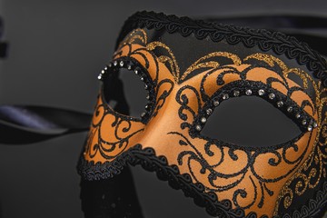 Traditional venetian carnival mask on black background.