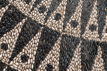 Decorative pebble mosaic on the streets of Rhodes. Greece