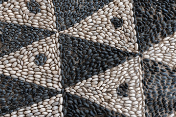 Decorative pebble mosaic on the streets of Rhodes. Greece