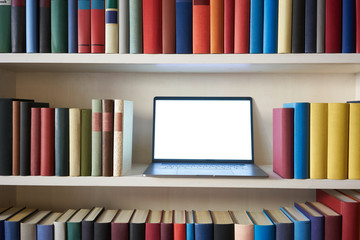 Computer technology in colorful bookcase
