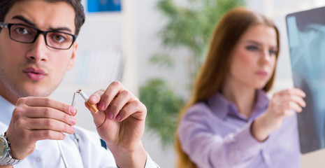 Doctor examining x-ray images of patient