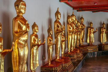Fototapeta premium 2011.05.16, Bangkok, Thailand. Elements of pavilions of the Grand Palace complex, blur and grain effect. Golden statue of Buddha.