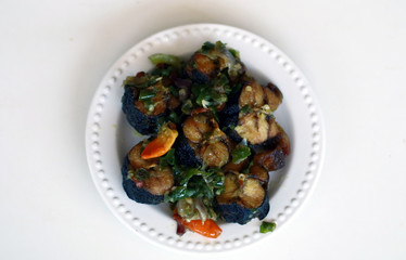 Fried Asian swamp eel with chili sauce or belut cabai hijau.