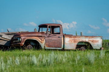 Old abandoned truck in junk yard on the prairies in Saskatchewan