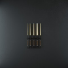 Billiard sticks banner on support with dark wall.