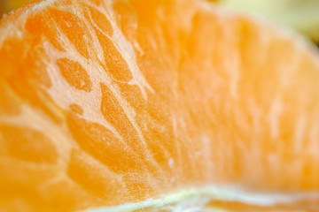 Mandarin peeled and slices on the background of macro