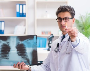 Doctor examining x-ray images of patient