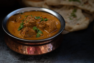 Indian vegan korma sauce served in copper bowl