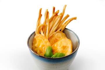 Polish traditional cheese oscypek - Oscypek isolated on white.  Oscypek on a plate.