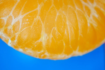 Mandarin peeled and slices on the background of macro
