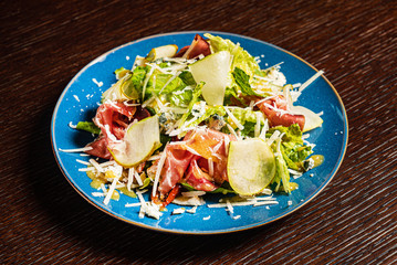 tasty salad with parma and cheese