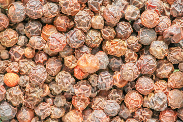 allspice grains macro as background