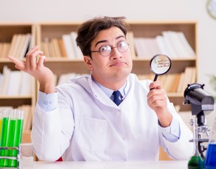 Mad crazy scientist doctor doing experiments in a laboratory