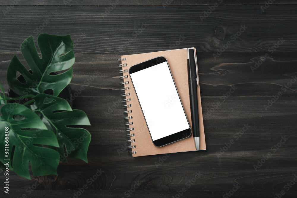 Poster creative workspace modern dark office desk with blank smartphone and pen on notebook,mockup topview