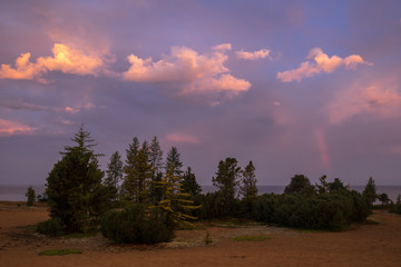 Rainbow in the dawn sky on Lake Baikal
