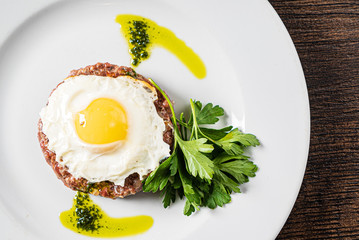 beef cutlet with egg and sauce