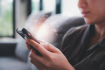 woman hand using smart phone with email icon,email marketing and newsletter concept.
