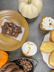 Overhead view of sweets consisting of Madeleine, Chocolate chip cookies and Brownies