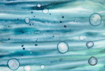 Watercolor background with artistic bubbles, brush strokes, stains, marks. Teal, green blue, golden, navy colors. Hand drawn watercolour graphic illustration. Beautiful backdrop for creative design.