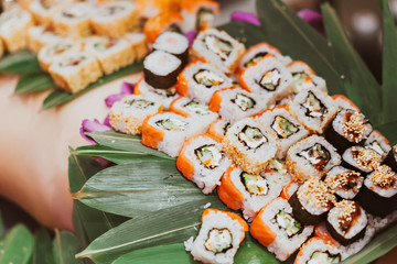 sushi in the woman in the restaurant. close up