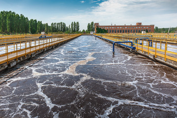 Tank or reservoir for biological purification and cleaning of dirty sewage water by active sludge....