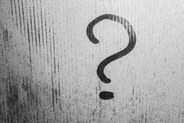 drawing a question mark on the sweaty glass background