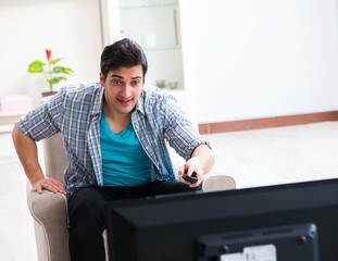 Man watching tv at home