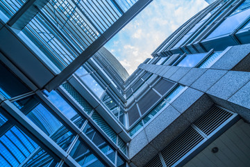 Fototapeta na wymiar modern office building,blue toned image,china.