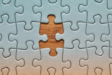 Jigsaw puzzle background, one last piece missing only, almost complete