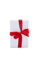 White gift box and red ribbon in season Christmas and new year isolated on white background, luxury present for birthday or anniversary with surprise in package for happy, holiday concept.