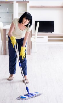 Old Mature Woman Tired After House Chores