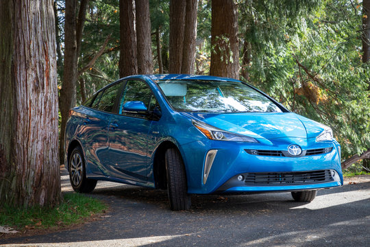 Bellingham, WA USA - 11/09/2019: Toyota Pirus Hybrid Auto with the Puget Sound in the Background