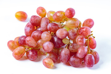 Grapes, on a white plate, on a wooden board, on a black plate