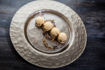 originally decorated four spherical sponge biscuits with caramel