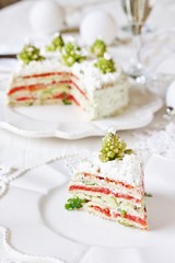 crep cake for Christmas and New Year.  Christmas tree decorations cabbage romanesco. Snack cake with salmon, avocado and soft cheese. Grains of cottage cheese play the role of snowdrifts.