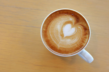 hot latte coffee drink put on wooden table in cafe restaurant