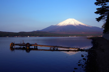 The mountain lake at the foot of Mount Fuji in Japan presents a beautiful and secluded volcanic reflection