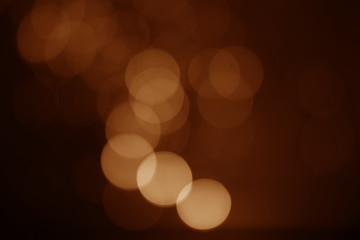 Orange light bokeh on a black background