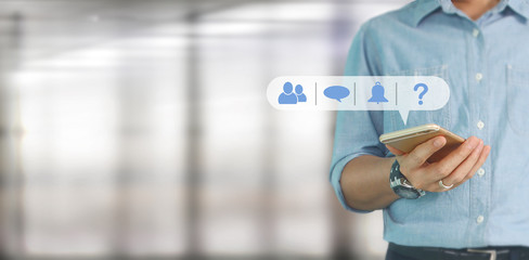 Man hand holding smartphone device and touching screen