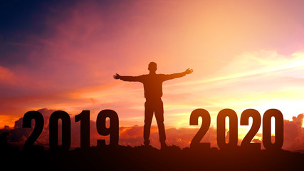 Silhouette young Business man happy to 2020 new year success concept.