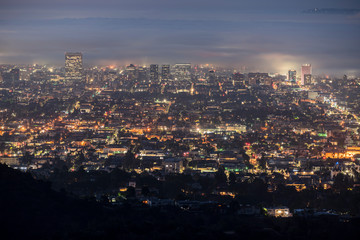 Foggy predawn twilight view of the Hollywood area of Los Angeles, California.  Photograph taken...