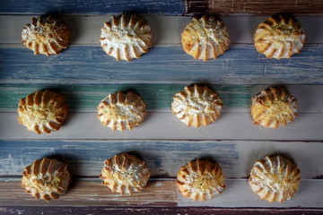 Baked homemade cookies on a colored wooden table