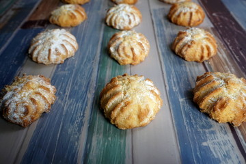 Baked homemade cookies on a colored wooden table