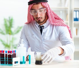 Arab chemist working in the lab office