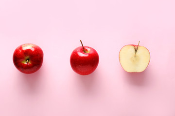 Fresh ripe apples on color background