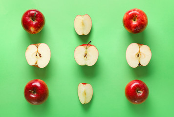 Fresh ripe apples on color background