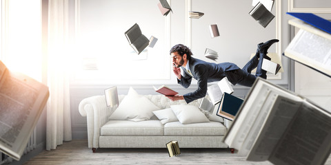Man flies and works on laptop. Mixed media