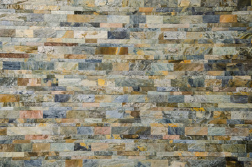 Wall and bricks of different colors.