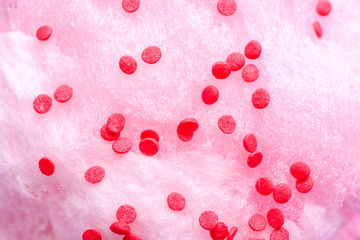 Tasty cotton candy with sprinkles, closeup