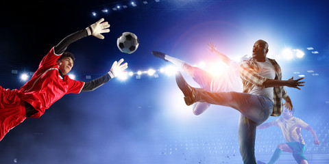 Soccer man in action with ball. Mixed media